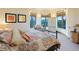 Comfortable bedroom with a cozy bed and mountain views from bay windows at 29115 Summit Ranch Dr, Golden, CO 80401
