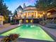 Luxury home with a sparkling pool, expansive patio, and stunning mountain views at 29115 Summit Ranch Dr, Golden, CO 80401
