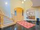 Elegant entryway with a grand staircase and hardwood floors at 29115 Summit Ranch Dr, Golden, CO 80401