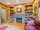 Cozy library with built-in shelves and fireplace at 29115 Summit Ranch Dr, Golden, CO 80401