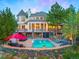 Stunning home exterior with stone accents and pool at 29115 Summit Ranch Dr, Golden, CO 80401