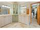 Double vanity bathroom with spacious cabinetry and access to a large closet at 29115 Summit Ranch Dr, Golden, CO 80401