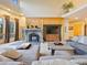Bright living room features a cozy fireplace and ample seating at 29115 Summit Ranch Dr, Golden, CO 80401