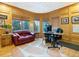 Home office with wood paneling, built-ins, and mountain views at 29115 Summit Ranch Dr, Golden, CO 80401