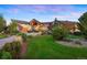 Grand home exterior with a welcoming entrance and manicured lawn at 19155 Lochmere Ct, Monument, CO 80132