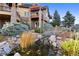 Landscaped backyard with a charming pond and bridge at 19155 Lochmere Ct, Monument, CO 80132