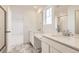 Bright bathroom with double vanity, marble floors and separate shower at 4847 Aster Way, Brighton, CO 80601