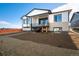 Two-story home with backyard deck and landscaping at 23845 E River Front Dr, Aurora, CO 80019