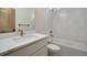 Modern bathroom with white quartz vanity and herringbone tile at 23845 E River Front Dr, Aurora, CO 80019