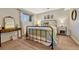 Basement bedroom with metal bed frame and vanity at 6215 Northwoods Glen Dr, Parker, CO 80134