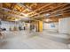 Unfinished basement with high ceilings and ample storage space at 114 Apache Plume St, Brighton, CO 80601