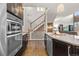 Open kitchen showcases double ovens and a view of the staircase at 2392 S Lupine Way, Denver, CO 80228