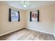 Well-lit bedroom with wood-look floors and ceiling fan at 1297 Worchester St, Aurora, CO 80011