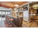 Gourmet kitchen with granite island, wood cabinets, and hardwood floors at 9983 Heather Dr, Castle Rock, CO 80108