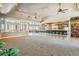 Large great room with high ceilings, a bar, and plush carpeting at 9983 Heather Dr, Castle Rock, CO 80108