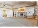 Spacious living room with a stone fireplace and hardwood floors at 9983 Heather Dr, Castle Rock, CO 80108