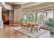 Elegant dining area with hardwood floors and large windows with a view at 9983 Heather Dr, Castle Rock, CO 80108