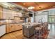 Large kitchen with light wood cabinets, granite countertops, and an island at 9983 Heather Dr, Castle Rock, CO 80108
