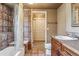 Bathroom with tiled shower/tub combo, vanity, and toilet at 9983 Heather Dr, Castle Rock, CO 80108