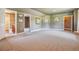 Spacious bedroom with carpet, access to bathroom and walk-in closet at 9983 Heather Dr, Castle Rock, CO 80108