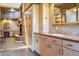 Bathroom with light colored wood cabinets, sink, and built in storage at 9983 Heather Dr, Castle Rock, CO 80108