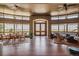 Bright dining area with large windows and access to patio at 9983 Heather Dr, Castle Rock, CO 80108