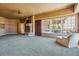 Spacious basement room with fireplace and large windows offering ample natural light at 9983 Heather Dr, Castle Rock, CO 80108