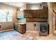 Laundry room with custom wood cabinets and tile flooring at 9983 Heather Dr, Castle Rock, CO 80108
