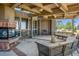 Relaxing patio with seating area and fireplace at 9983 Heather Dr, Castle Rock, CO 80108