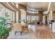 Bright dining area with hardwood floors and large windows offering scenic views at 9983 Heather Dr, Castle Rock, CO 80108