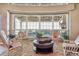 Sunroom with wicker furniture and views of the backyard at 9983 Heather Dr, Castle Rock, CO 80108