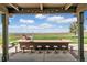 Outdoor patio with built-in bar, seating, and mountain views at 9983 Heather Dr, Castle Rock, CO 80108