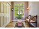 Bright hallway with built-in bench and large window at 9983 Heather Dr, Castle Rock, CO 80108