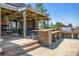 Outdoor kitchen and patio with seating and views at 9983 Heather Dr, Castle Rock, CO 80108