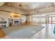 Large living room with hardwood floors, stone fireplace, and high ceilings at 9983 Heather Dr, Castle Rock, CO 80108
