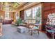 Home office with stained glass ceiling, comfortable seating and large windows at 9983 Heather Dr, Castle Rock, CO 80108