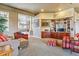 Comfortable living room with built-in shelving and a view into another room at 9983 Heather Dr, Castle Rock, CO 80108