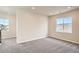 Well-lit bedroom with neutral walls and plush carpeting at 2561 Lupton Ln, Lafayette, CO 80026