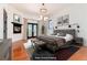 Virtually staged main bedroom with a fireplace and access to a deck at 3823 Castle Butte, Castle Rock, CO 80109