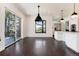 Bright dining room with dark hardwood floors and access to a deck at 3823 Castle Butte, Castle Rock, CO 80109