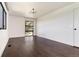 Spacious bedroom with dark hardwood floors and a window with treetop views at 3823 Castle Butte, Castle Rock, CO 80109