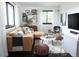 Cozy living room with a leather couch and modern decor at 3823 Castle Butte, Castle Rock, CO 80109