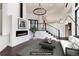Virtually staged living room with fireplace and modern furniture at 3823 Castle Butte, Castle Rock, CO 80109