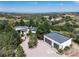 High-angle view of a modern home with detached garage and scenic mountain views at 3823 Castle Butte, Castle Rock, CO 80109