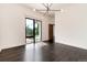 Bright bedroom with dark hardwood floors and backyard access at 3823 Castle Butte, Castle Rock, CO 80109