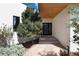 Modern home exterior with stone pathway, landscaping, and a contemporary front door at 3823 Castle Butte, Castle Rock, CO 80109