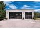 Modern two-car garage with glass doors at 3823 Castle Butte, Castle Rock, CO 80109