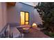 Cozy patio area with a fire pit and comfortable seating at dusk at 3823 Castle Butte, Castle Rock, CO 80109