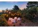 Secluded patio seating area with string lights, perfect for outdoor entertaining at 3823 Castle Butte, Castle Rock, CO 80109