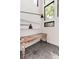 Home office with rustic desk and dark hexagonal tile floor at 3823 Castle Butte, Castle Rock, CO 80109